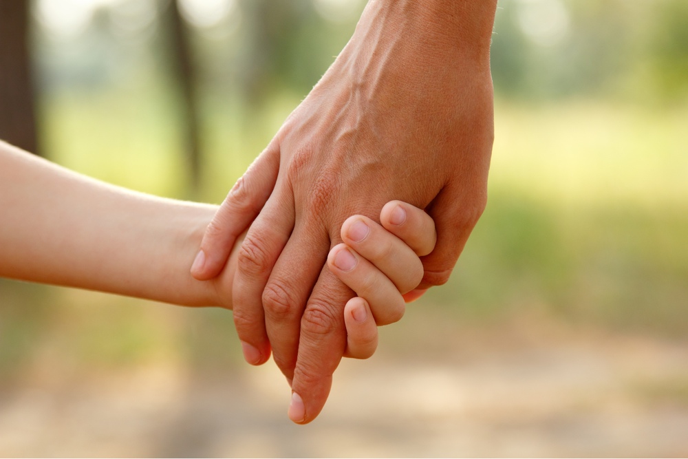 holding hands mom and child